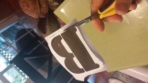 dresser cutting out letter